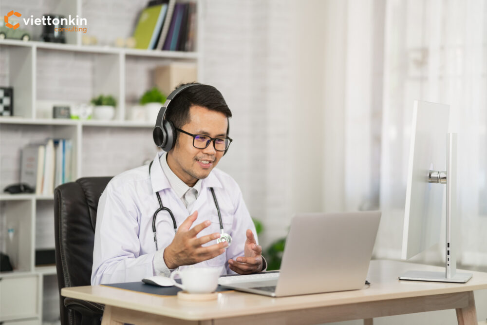 Medtech industry development enabling telemedicine, with doctor consulting patients online via video call and digital healthcare tools