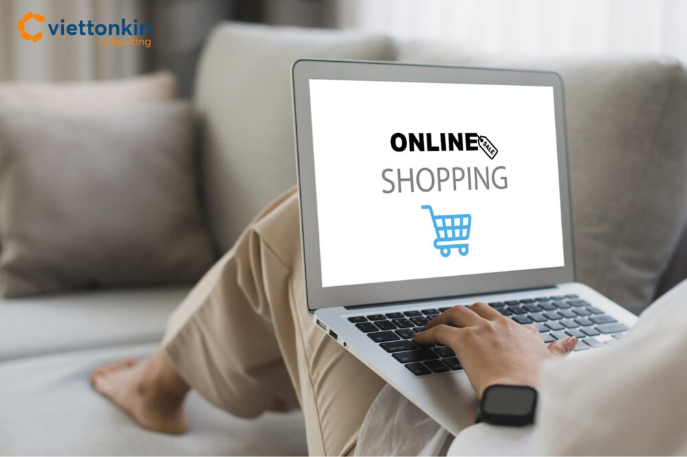 A person shopping online on a laptop, reflecting Vietnam’s shift from traditional markets in Ho Chi Minh City to digital e-commerce platforms.