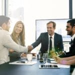 Business handshake acquisition meeting in Vietnamese manufacturing