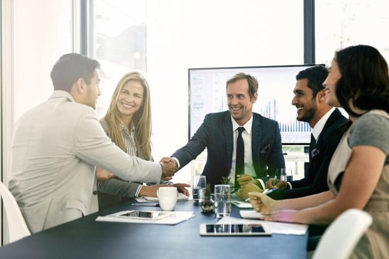 Business handshake acquisition meeting in Vietnamese manufacturing