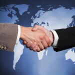 International business partnership handshake