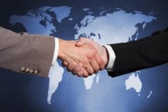 International business partnership handshake