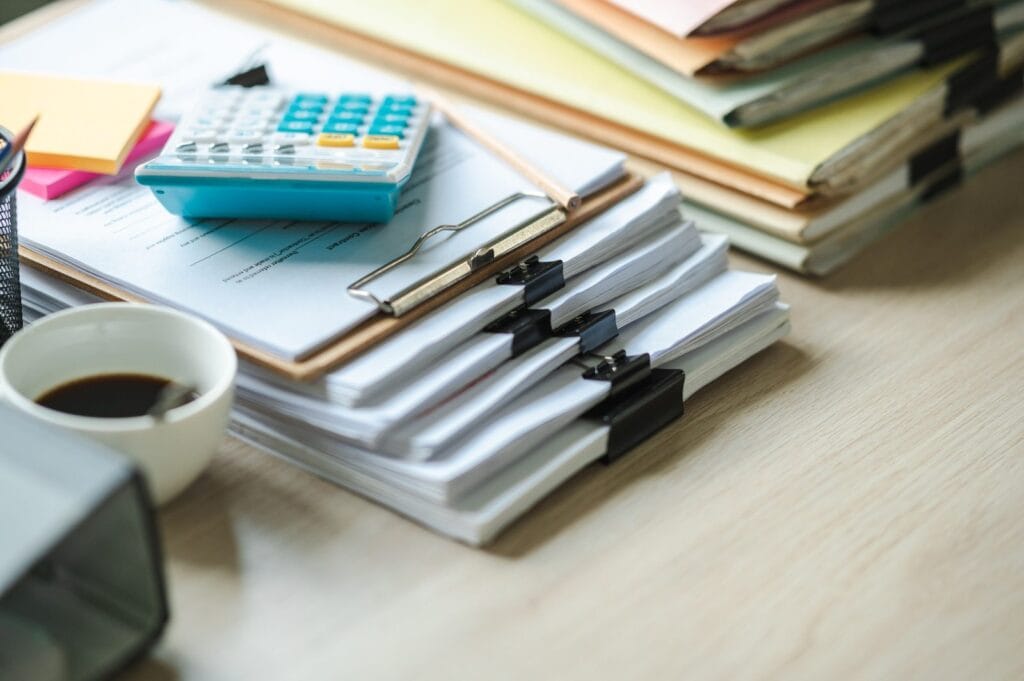 Accountant reconciling corporate income tax filings against qualifying R&D expenses